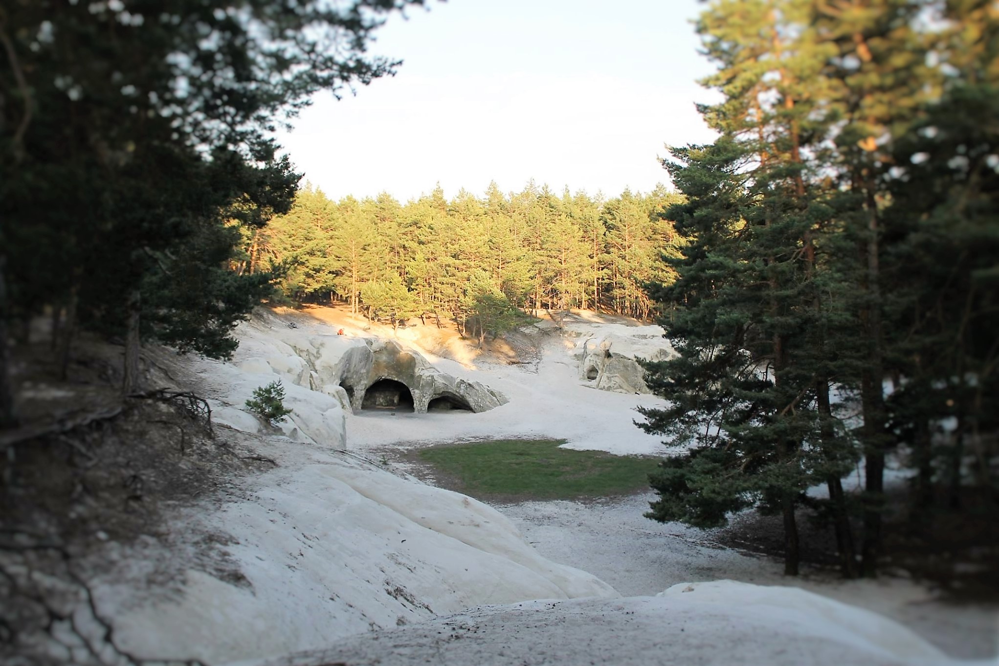 Sandstone caves in the forest at sunset